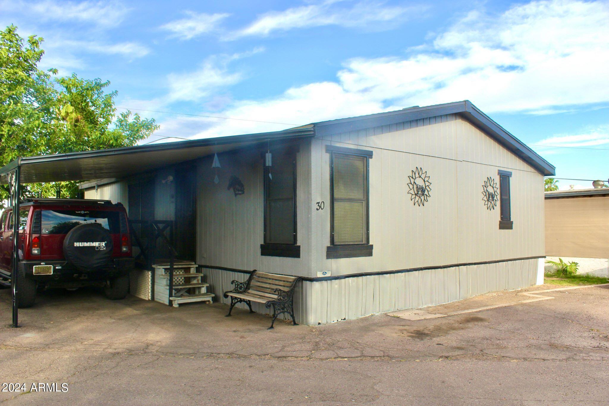 Photo 1 of 26 of 4950 W BETHANY HOME Road 30 mobile home