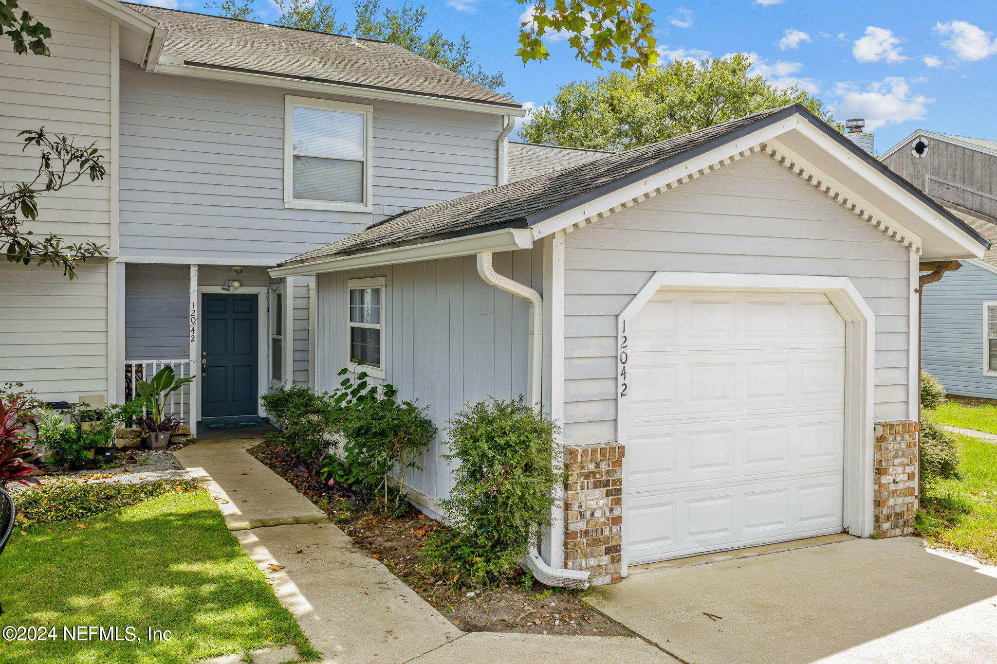 Photo 1 of 27 of 12042 COBBLEWOOD Lane N townhome