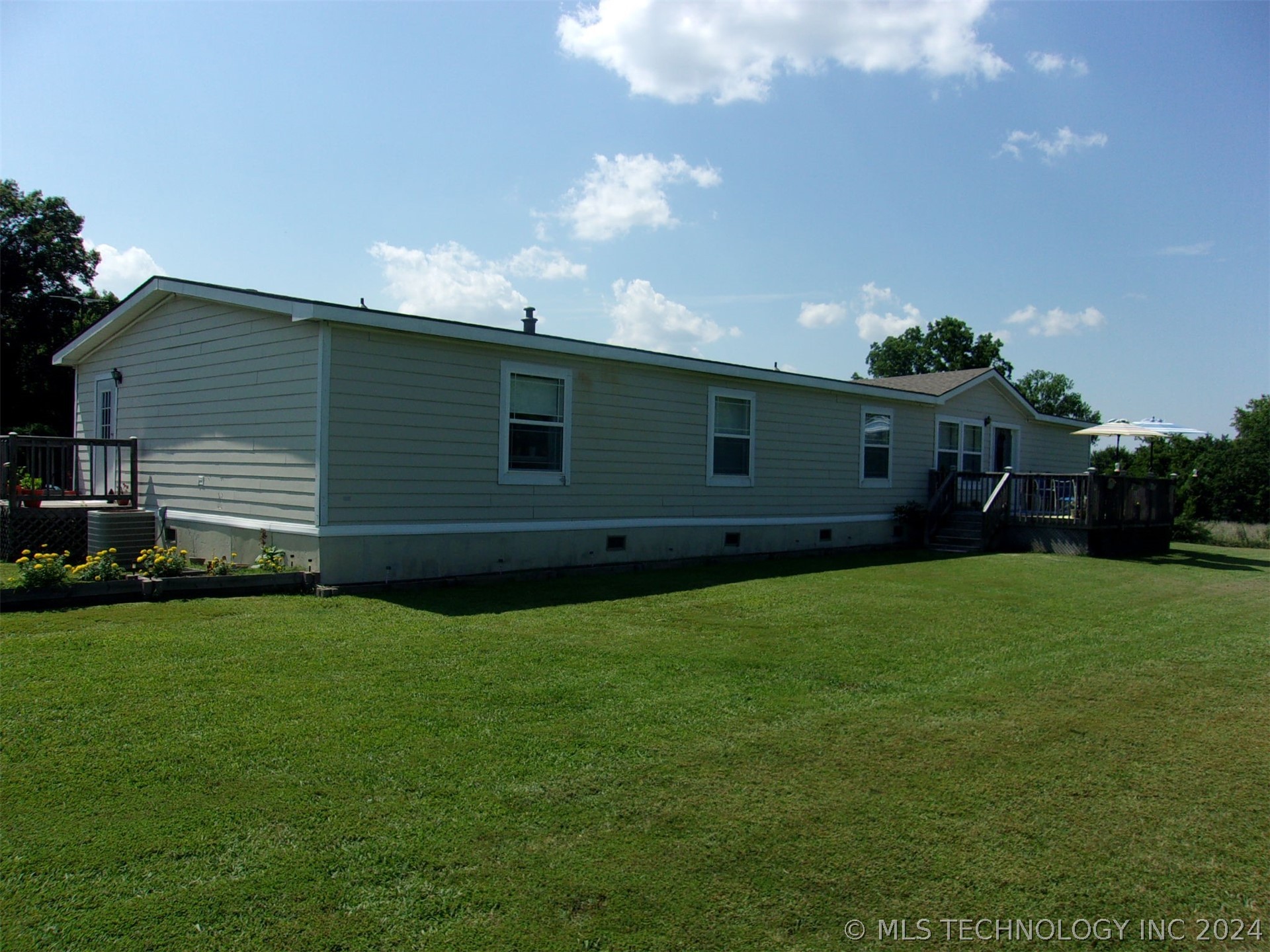 Photo 1 of 58 of 7411 N 49th Street E mobile home