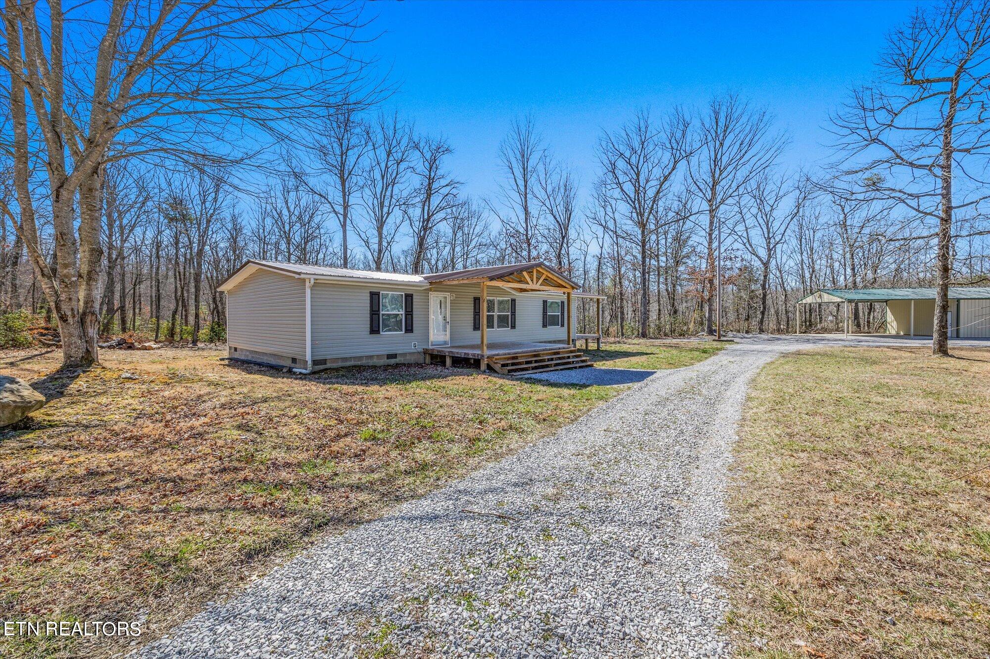 Photo 3 of 32 of 6889 Baker Mountain Rd mobile home